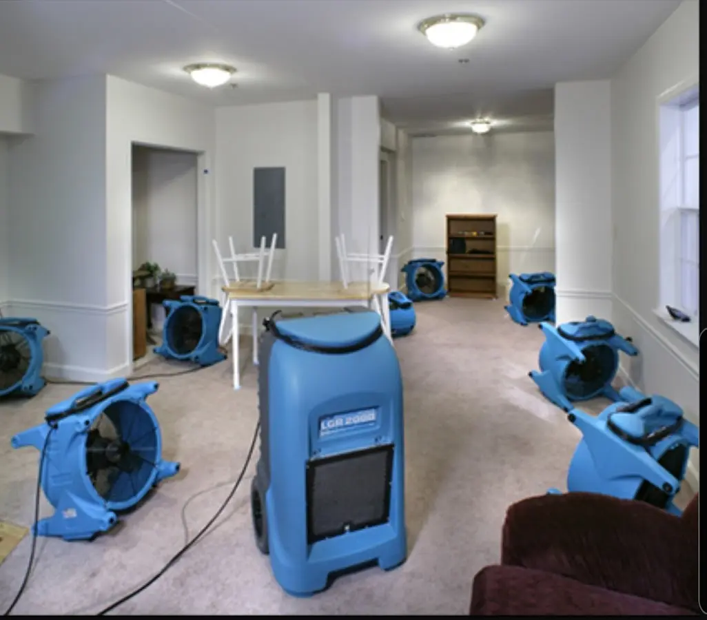Air movers and dehumidifier setup for Water Damage Restoration in West Point